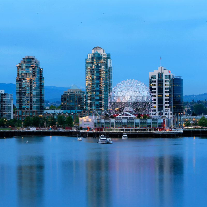 Image of Vancouver skyline night view, Vancouver Science World and Downtown buildings in view.